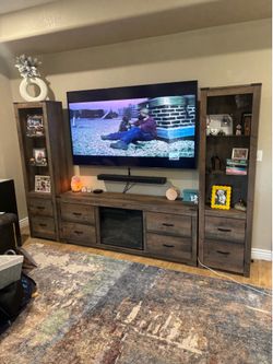 Lighted entertainment center with fireplace