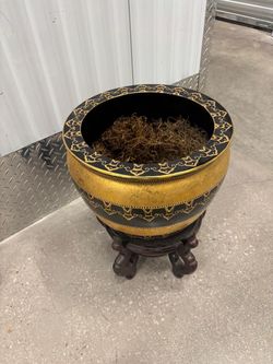 Stylish Gold and black pot with wooden stand.  14” around , 19” high  $70