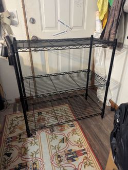 Black metal shelving unit 35.5x18x36