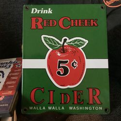 Vintage 1992 Drink Red Cheek Cider Sign 5¢ Walla Walla Washington RareThis vintage porcelain sign from 1992 features the iconic red cheeked cider bott