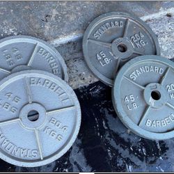 TWO PAIRS OF OLYMPIC CAP 45 LB. PLATES = (FOUR 45 LB. PLATES)