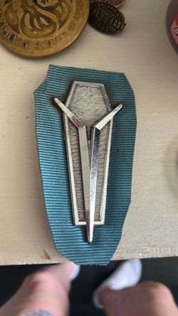Rear seat medallion for a mopar