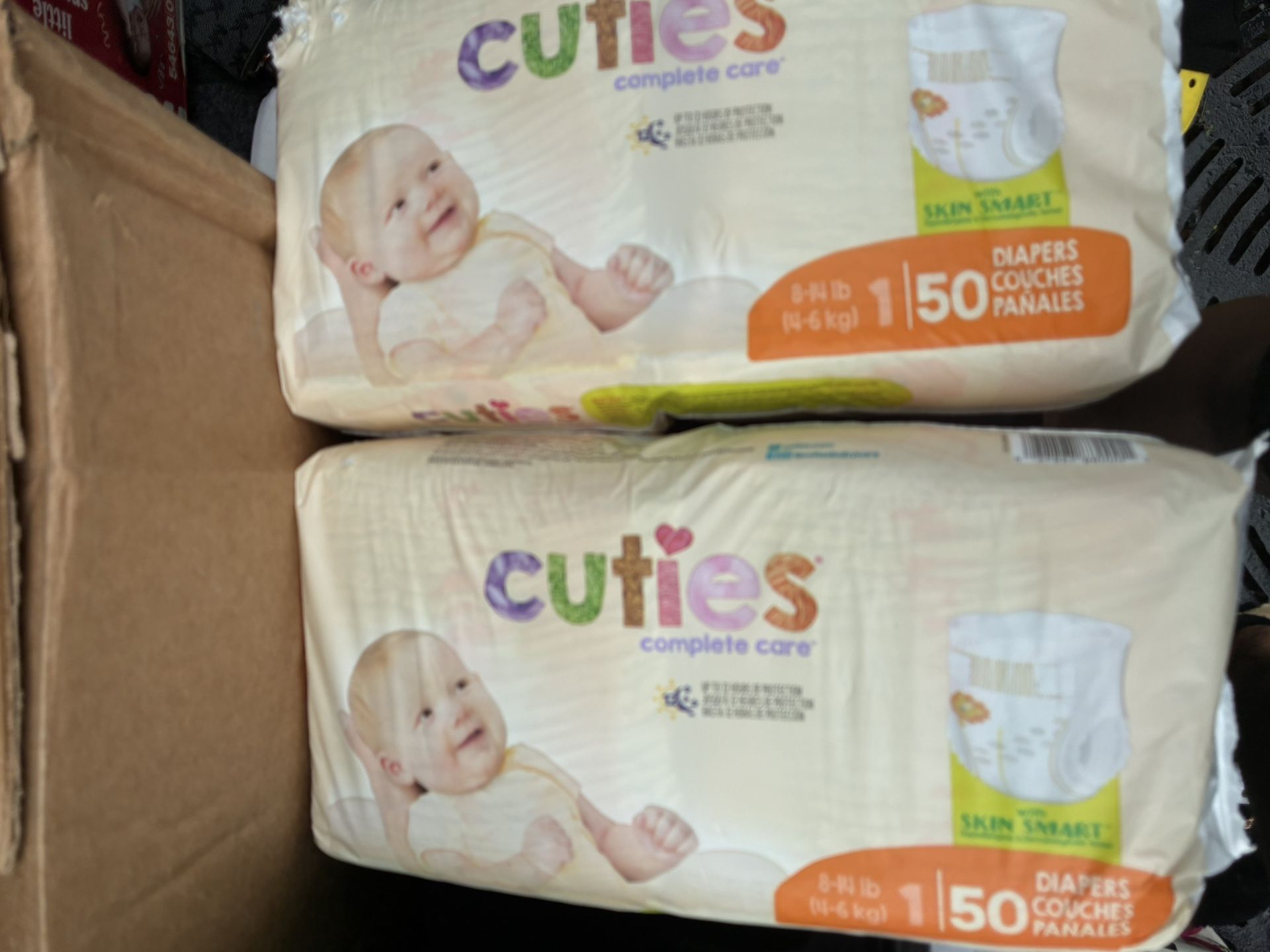 4 Packs Of Diapers 