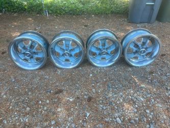 15x7 Oldsmobile Rally wheels with center caps and rings