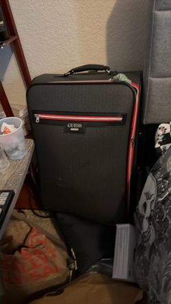 Large guest, leather suitcase, gray, and red