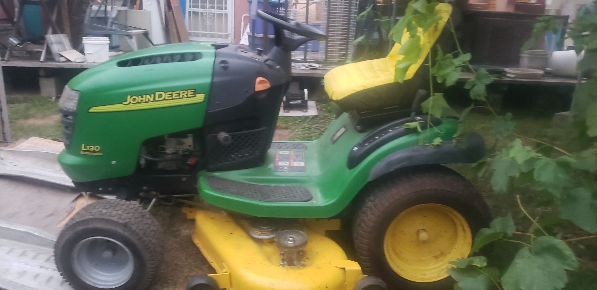 John Deer L130 riding lawn tractor (lots of new parts/like new)