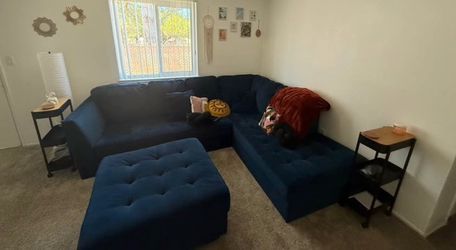 Blue sectional sofa with ottoman