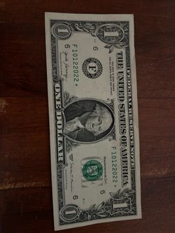 One dollar bill with birthday on it