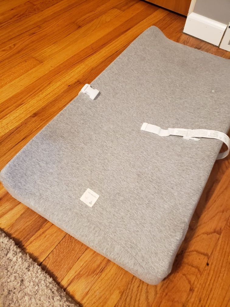 Baby changing table pad and Burt's Bees Baby cover