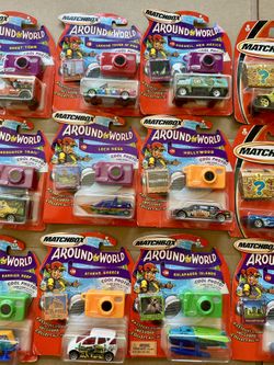 Lot of 20 Matchbox Cars – 13 Around the World & 7 The Wall Eater – Bonus Prize Inside