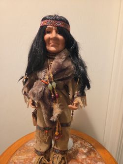Elder native porcelain doll