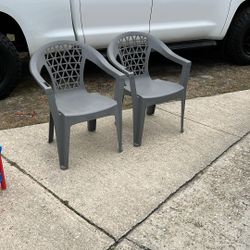 Two Gray Plastic Chairs Take Both For 10
