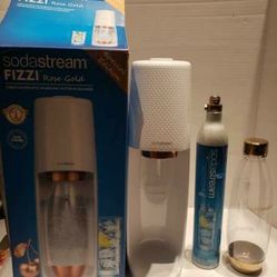 SodaStream rose gold edition with a gold 1 liter bottle barely used like new and 1 Canister selling for only $60
