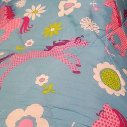 1 Twin  Comforter, 1 Twin Bed Skirt, 1 Pillow, 2 Crosses, 1 Pink Horse Wall Decor