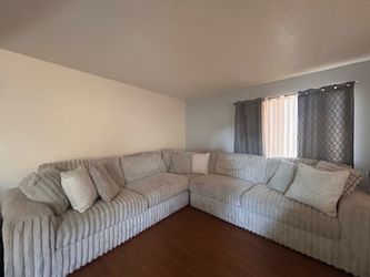 Large L-Shaped Sectional Sofa with Pillows