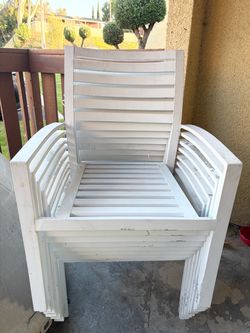 9 white metal chairs