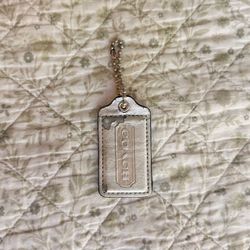 Coach silver metallic hang tag