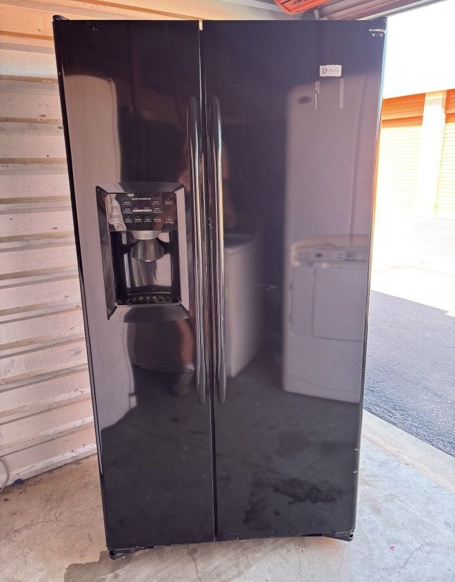 Black GE Refrigerator And Freezer