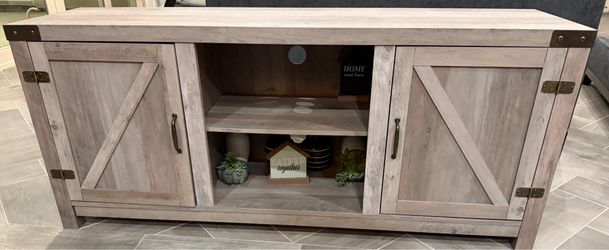 LIKE NEW- Ashley further brand  2 Door 60" TV Stand with Open Center Shelving Dimensions Width: 60