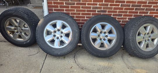 265/65R18 GMC LT tires with rims