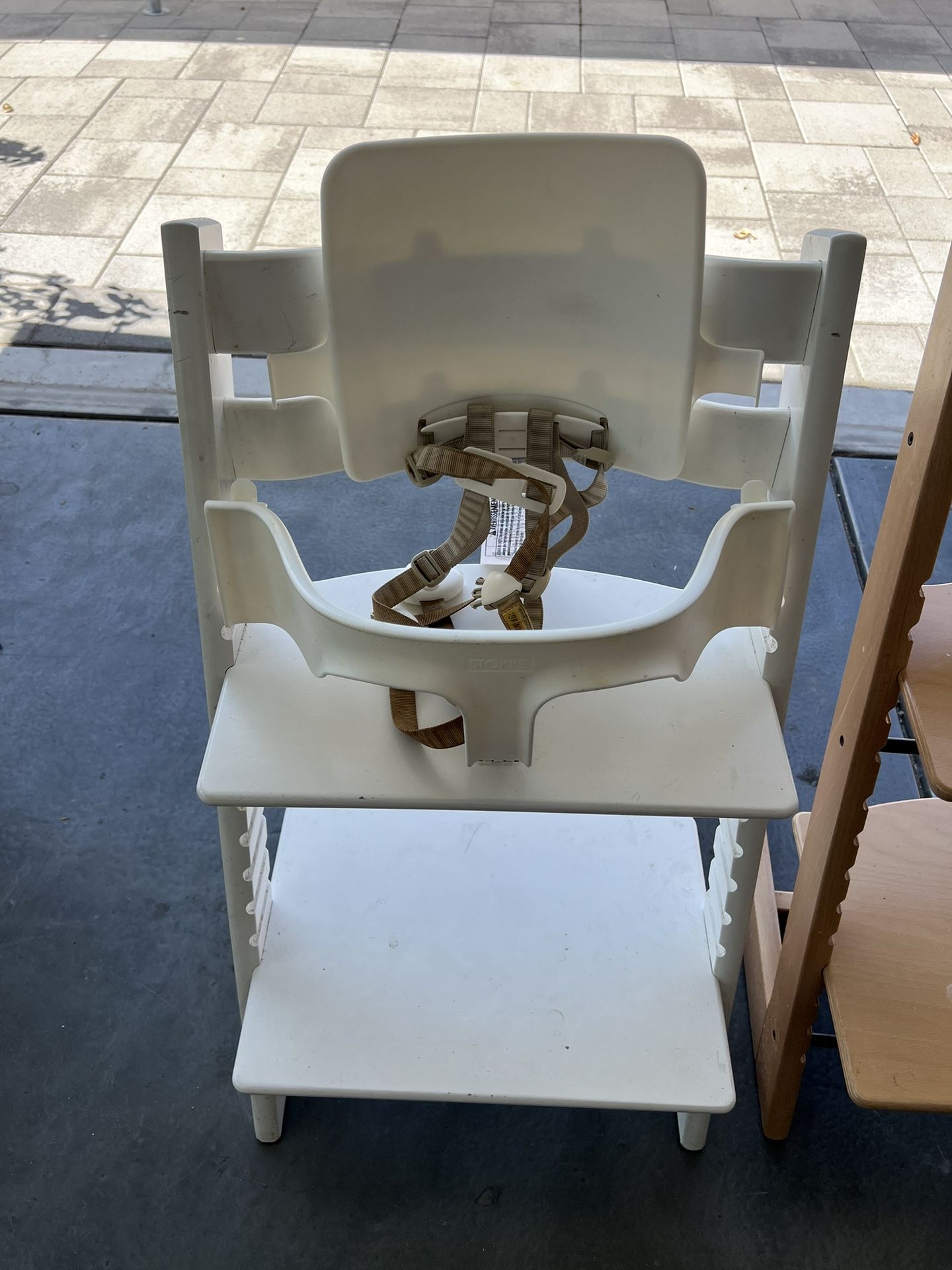 White Stokke Chair with harness