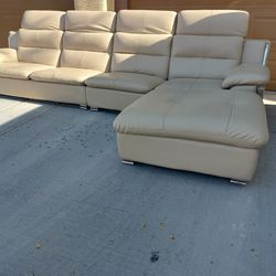 Leather Sectional, 11ft 8in x 6ft.  Headrests Raise & Lower. Very Good except for tiny bit of on sofa seat. Chaise & Middle Section good. See Last Pic