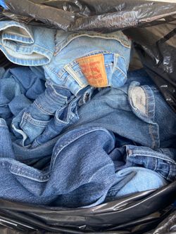 Huge bag of assorted jeans different sizes
