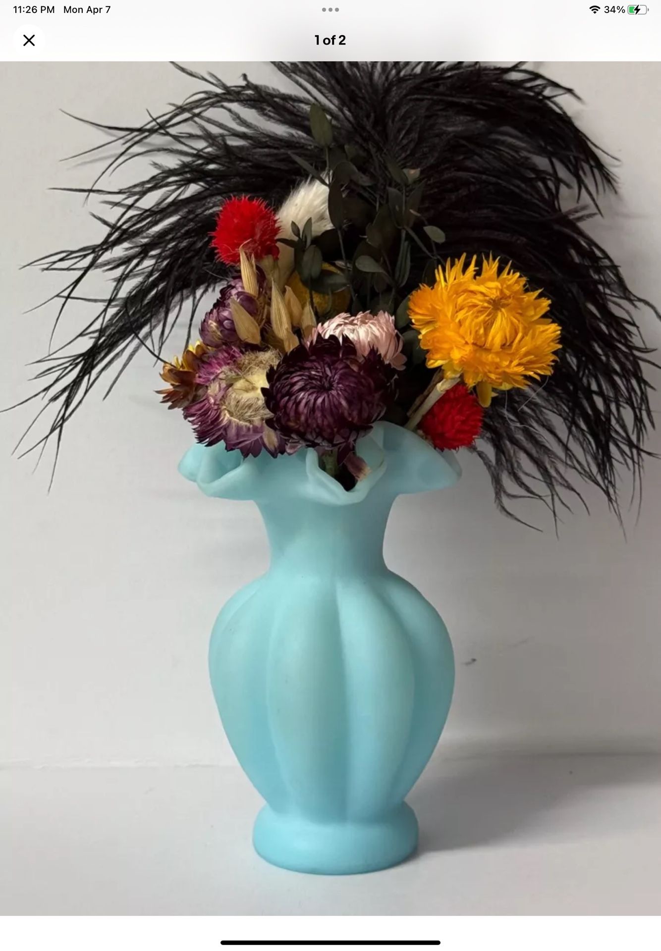 Vintage Fenton vase boasts a luxurious blue satin glass finish.