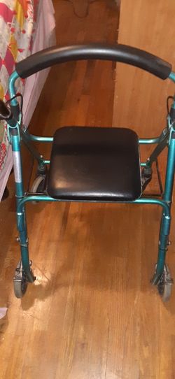 Wheeled walker with seat &hand brakes