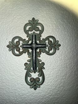Sage green ornate metal cross with central dark cross and scrollwork