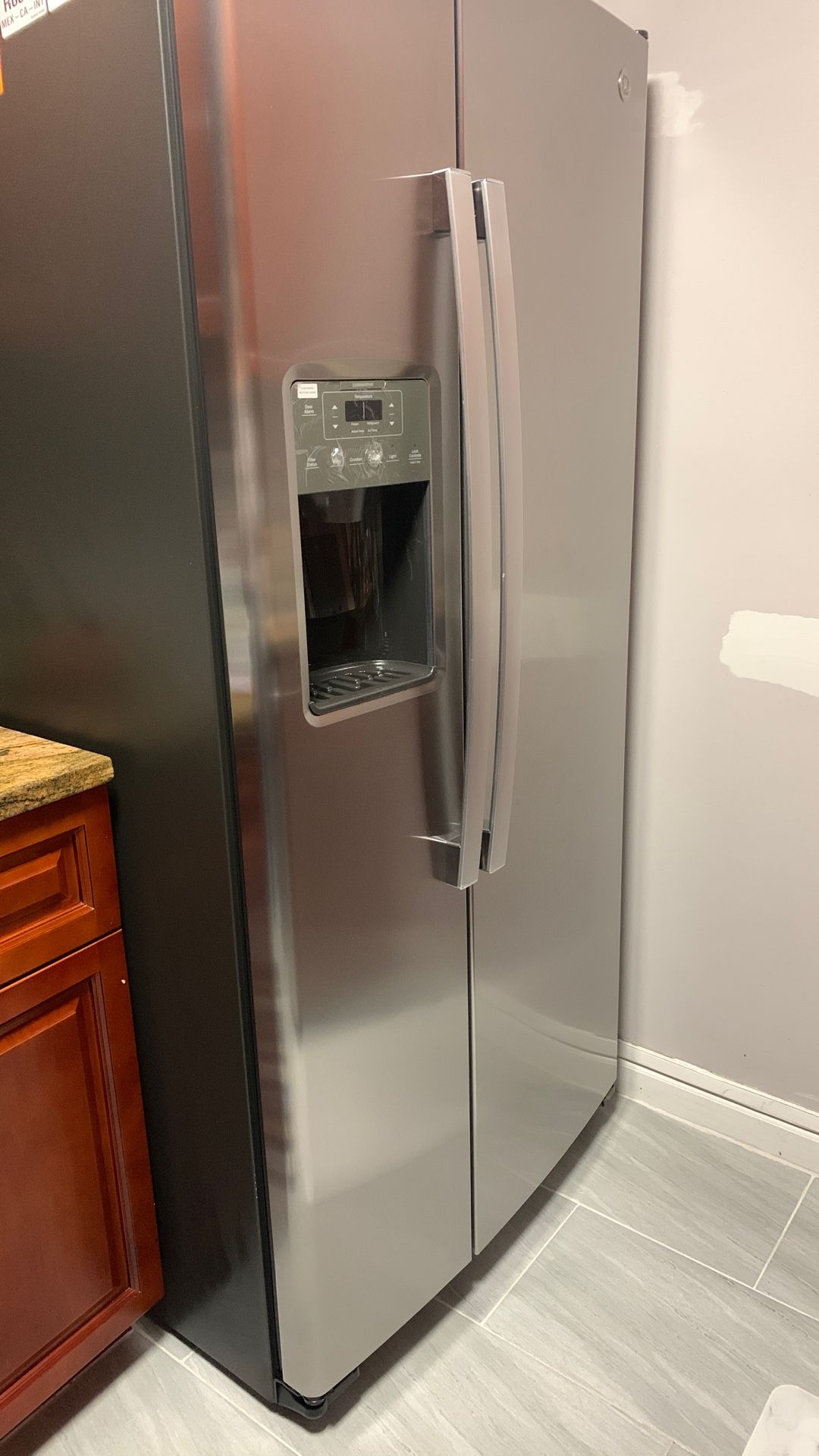 GE® 33 in. 23.0 Cu. Ft. Fingerprint Resistant Stainless Steel Side-by-Side Refrigerator