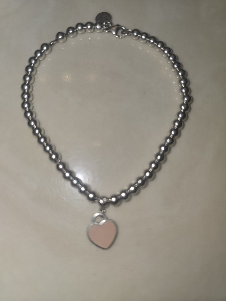 TIFFANY & CO. STERLING SILVER PINK ENAMEL HEART BRACELET 