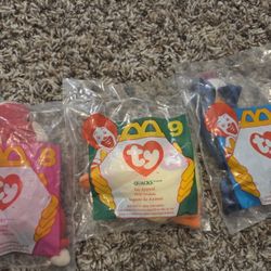 This product is a set of three vintage Teenie Beanie Babies from Ty, originally distributed by McDonald's in 1993 and 1996. The set includes the chara