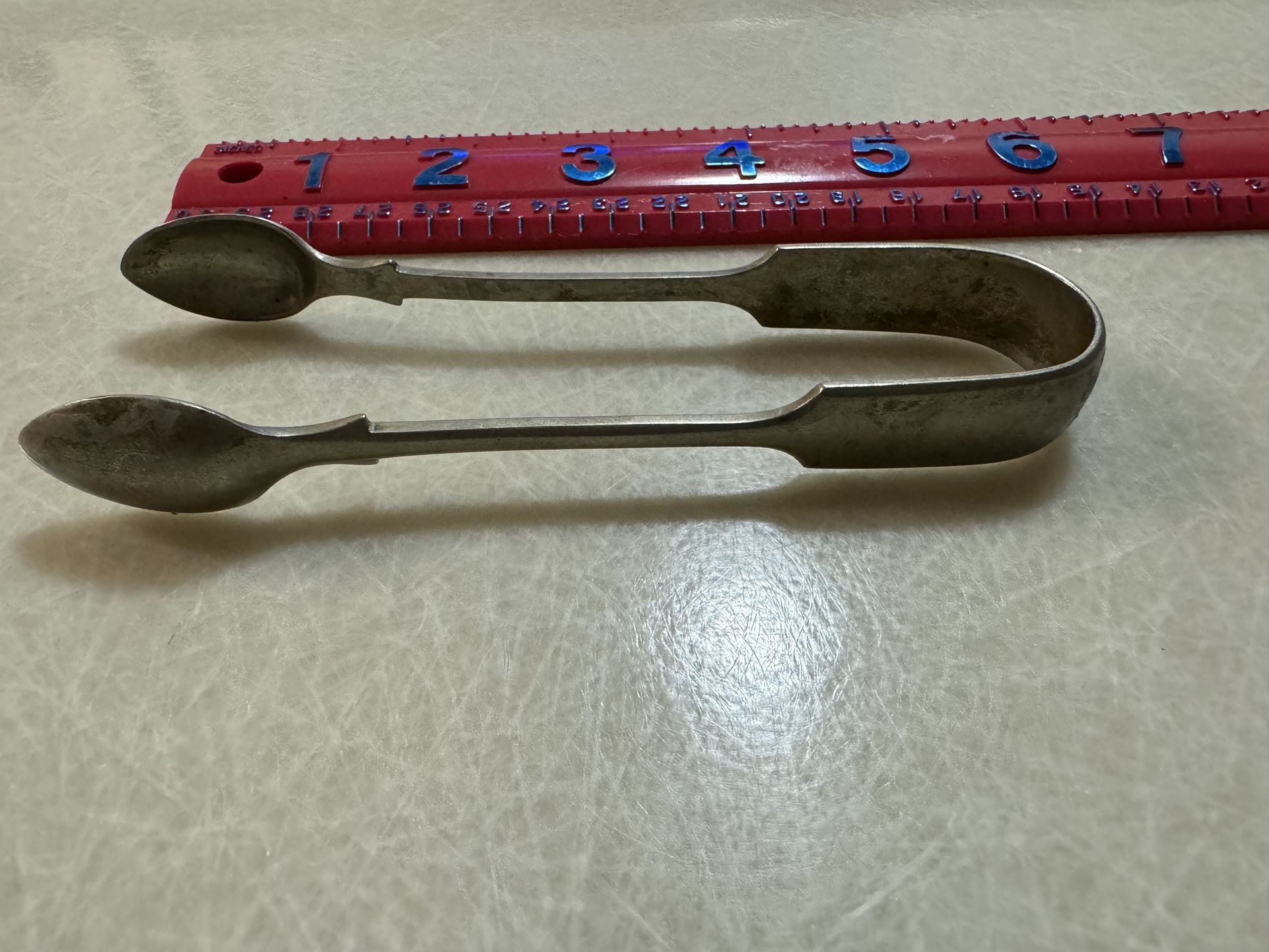 CA. 5” SUGAR CUBE SPOON. HAS HALLMARKS. SEE PICS.