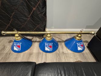 New York Rangers 3-Shade Billiard Light with a brass fixture.
