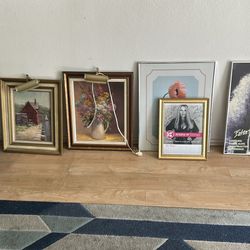 Assorted collectible paintings and posters