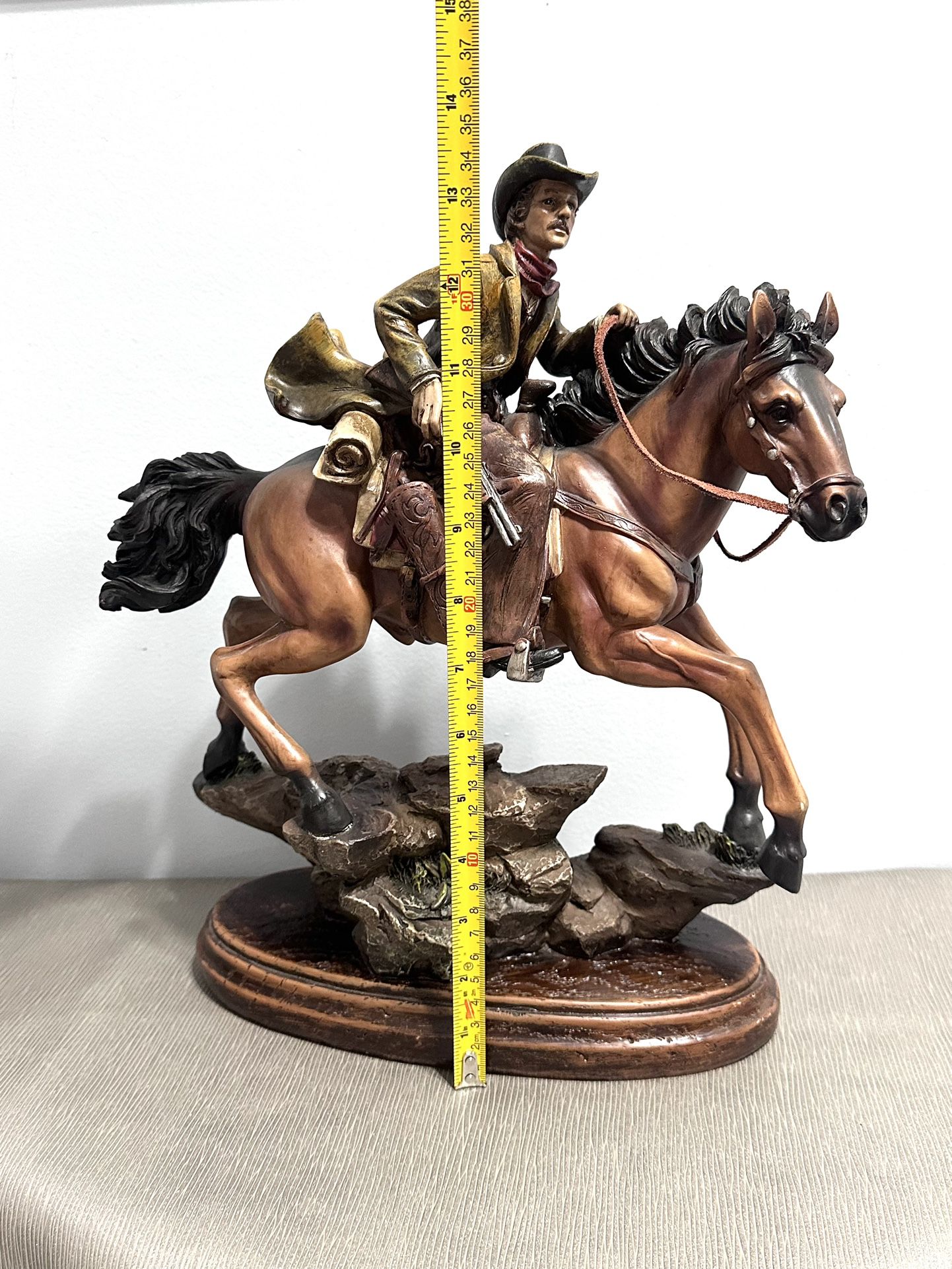 Cowboy on horse with riffle statue. 14” tall  