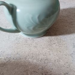 Vintage teapot and white mug/bowl.