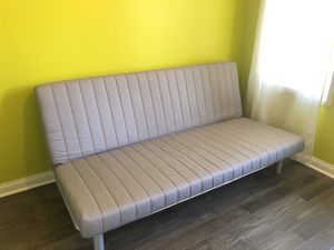 Photo Convertible sofa to full bed. IKEA futon.