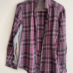This is a plaid shirt with a patchwork design. • Main color: It features a classic plaid pattern interwoven with purple, pink, white, and black (deep 
