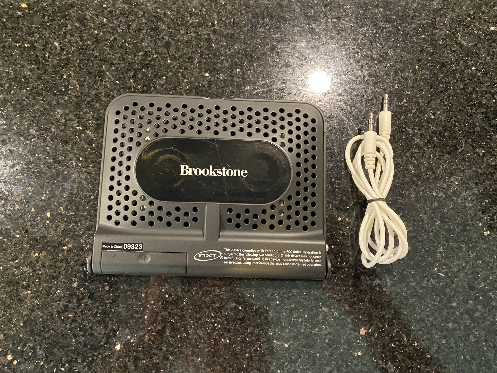 Brookstone Ultra-Thin Travel Speaker 5x6x3/4” with 3.5mm Audio Wire