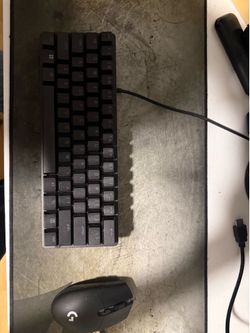 Razor huntsman mini, Logitech wireless mouse, and a Corsair mouse pad