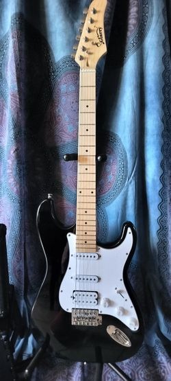 Brand new electric guitar with new bag cable and shoulder strap