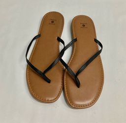 Tan flip flops