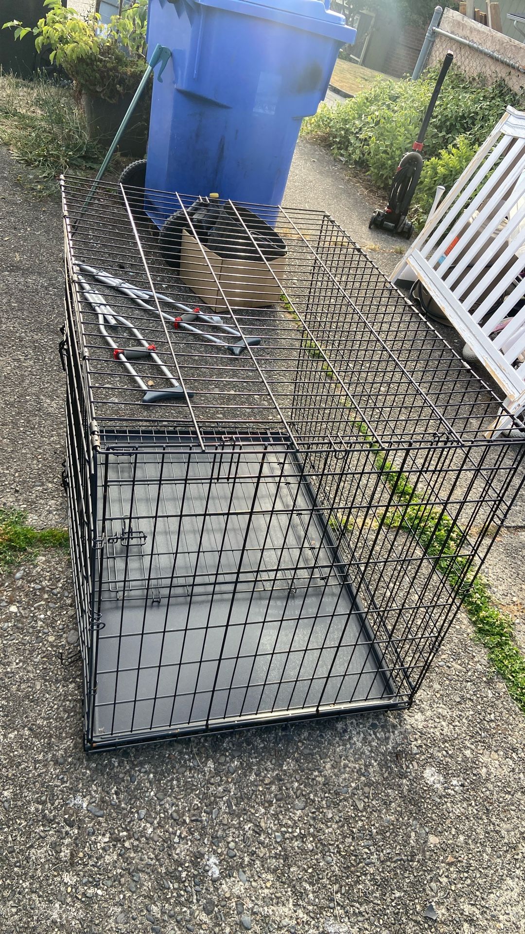 Dog Crate Size Length 42 Double Door, Collapsible. Price 45$. Pick Up. E. 72nd. and Grand View. E. Tacoma