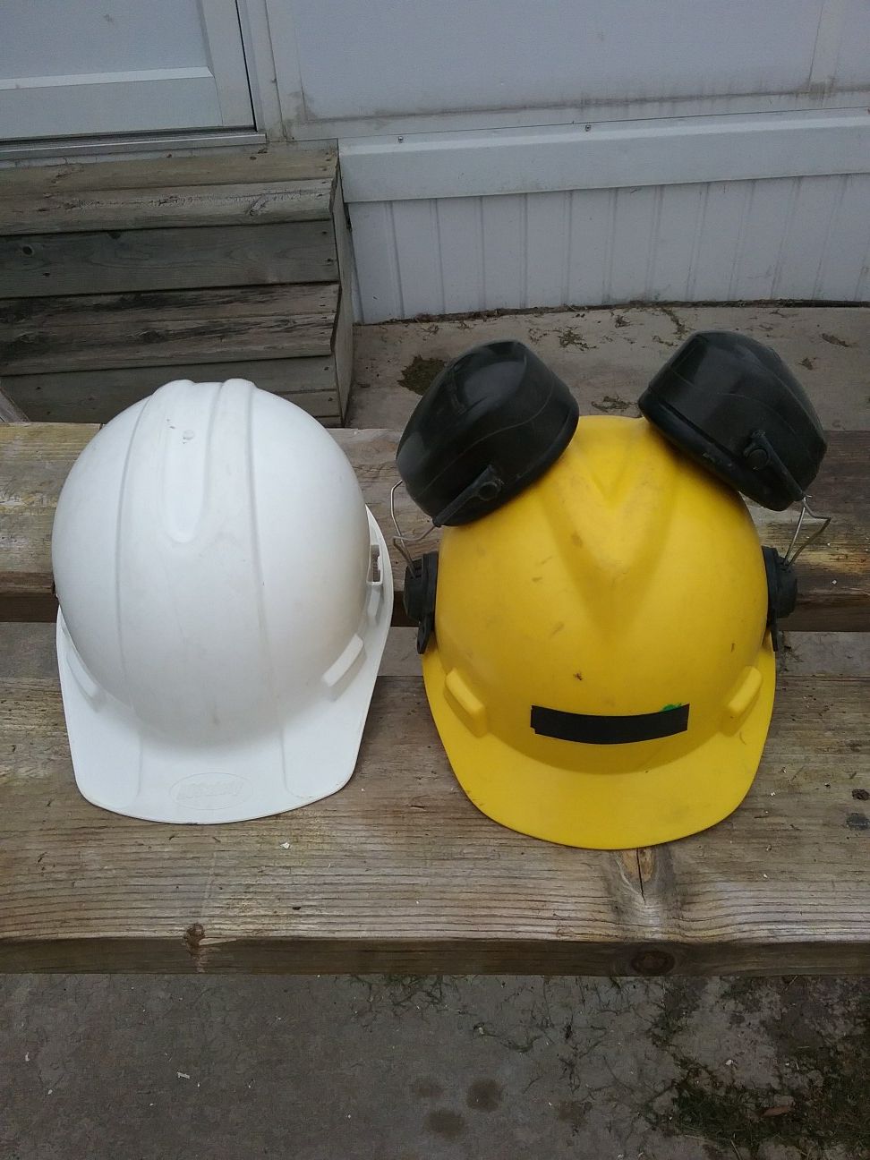 2 hard hats, 1 with ear protection