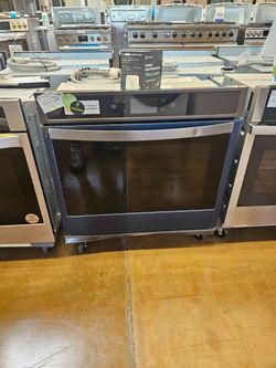 Black Stainless steel oven Whirlpool 30 inch wide with convection fan inside 