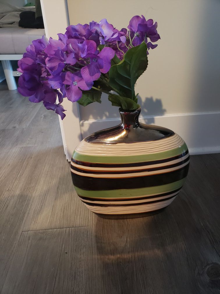 Vase with plastic purple flowers