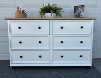Beautiful white wood dresser with natural wood top and black accents