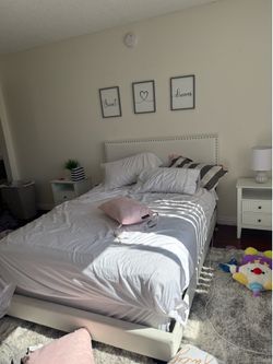 Full-size bed with mattress and boxspring